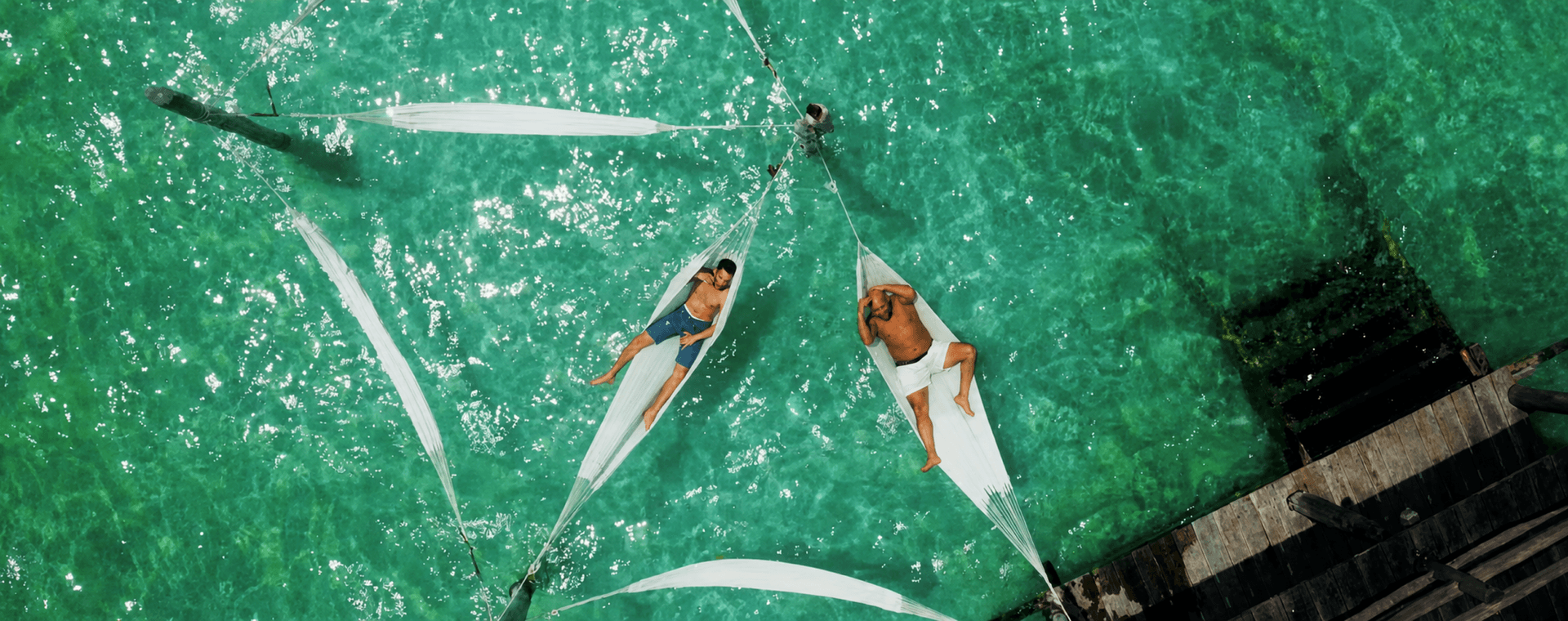 Waterfront hammocks swaying with the jungle breeze